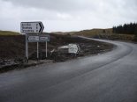 Did someone forget to remove the old sign?  Or is it there for the sheep to follow?